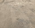 Дорога идущая от города (района) Вятские Поляны до конца деревни Нижние Шуни Вятскополянского района Кировской области разрушена и имеются отслоения верхнего слоя асфальта, проседания либо выпучивания грунта из под дорожного покрытия, большие трещины в асфальте. Вышеизложенные дефекты дорожного полотна не соответствуют предельно допустимым нормативным размерам, в соответствии с требованиями ГОСТ Р 50597-2017 «Автомобильные дороги и улицы. Требования к эксплуатационному состоянию, допустимому по условиям обеспечения безопасности дорожного движения». 
Жителями деревень Средние Шуни, Сосмак, Нижние Шуни неоднократно писались обращения, жалобы в ГИБДД, на имя главы Вятскополянского района Кировской области, однако до сих пор никаких мер по асфальтированию дорог на вышеуказанном участке дороги не принято. Из полученных ответов следует только одно, что нет бюджетных средств на ремонт и.т.п., а проблема так и не решается.
Я и жители Среденешунского сельского поселения Вятскополянского района Кировской области не просят ни в коем случае подводить дорогу к каждому дому, просто нам нужна одна, центральная дорога, соединяющая нашу деревню с цивилизацией (от города Вятские Поляны до конца деревни Нижние Шуни). При необходимости до деревни Нижние Шуни, Средние Шуни, Сосмак, не может вовремя доехать машина скорой помощи, служба спасения, пожарная машина и полиция, что ставит под угрозу мое здоровье и безопасность, а также здоровье и безопасность членов моей семьи и жителей. В итоге опасные ситуации на дорогах, возникающие в данных населенных пунктах Сосмак только усугубляются и могут закончится человеческими жертвами. Все это вышеуказанное нарушает наши права и свободы (граждан): 
- свободу передвижения (ст. 27, п. 1 Конституции Российской Федерации);
- право на передвижение по качественным дорогам, на ремонт и обустройство которых мы жители ежегодно производим налоговые отчисления (согласно ст. 357, глава 28, раздел IX, часть II Налогового кодекса Российской Федерации). Прошу Вас оказать помощь по асфальтированию дороги в деревне Нижние Шуни, Сосмак, Средние Шуни.