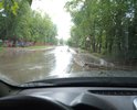 На данном участке улицы Ленской постоянно образуется лужа после осадков. Уходит вода медленно, защиты тротуара и пешеходов от брызг нет. Данное место уже переделывали один раз - результата нет