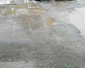 Дорога и стоянка у здания детского отделения больничного комплекса находятся в очень плачевном состоянии. Как на легковых автомобилях подъехать не просто, особенно после дождя, так и родителям с колясками преодолеть эту дорогу длиной менее 100 м, состоящую из полуразрушенных каменных плит с торчащей железной арматурой со всех сторон, получается с трудом. Поэтому многие не желая ездить по этим ямам решают свою проблему, паркуясь под знак "остановка запрещена" на ул. Еловой