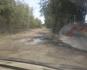 Такая вот дорога к асфальтовому заводу. Старая убитая бетонка, всюду ямы и лужи. Признаков ремонта не видно.