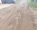 Подсыпали песком ямы. после дождя каша.