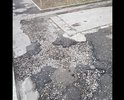 Требуется ямочный ремонт и ремонт тротуара.