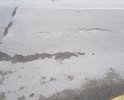 На участке ул. Маршака образовальсь выбоины и деформации дорожного покрытия; на правой полосе (по направлению к пл. Маршака, к/т Спартак) асфальт продавлен, образовалась колея.