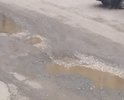 Глубокие ямы на проезжей части. Положите пожалуйста асфальт.