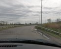 Разбитый старый асфальт.Требует полной замены.Так же требуется тротуар и дополнительное освещение.