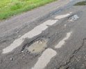 Разбитый асфальт с 2000годов.Требует ремонта.Так же требуется освещение улицы.Фонарей нет.