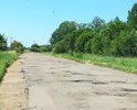 Дорога из деревень Вороново и Большое Вороново, по которым дважды в день ездит рейсовый автобус, а также школьный автобус. Ямы большие и глубокие, местами - более 10 штук на 1 метр дороги.