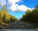 Многочисленные ямы на 65-66 км трассы Ухта - Вуктыл