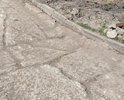 Проезд между домами ул. Запорожская 17, 17а и 19: поврежденное в результате проведения ремонтных работ на теплосетях дорожное полотно никто не спешит восстанавливать.