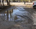 С обеих сторон вокруг дома - огромные ямы... Как в принципе, и в самом дворе.