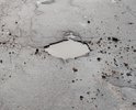 От поворота на лужки в сторону озерков дорога с ямами