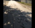 Дорога в колеях и часто под водой на яме на 1 фото часто пробивают шины и на въезде во двор игдустриальна 1 б большая яма прошу содействия в ремонте.