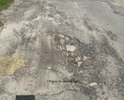 разбитое дорожное покрытие