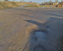 Сьезд с трассы в сторону д. Глушни. Бывшая старая дорога в сторону Пскова, до начала д. Глушни. Когда проводили асфальтирование дороги д.Глушни-д.Ногино-д.Рядобжа, этот участок остался без ремонта.