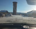 Улица Коммунальная. В самом центре поселения не делалась никогда на 5% был асфальт в 70-ых годах но уже рассыпался полностью. Грунт супесь. Плэтому для удобства строительной техники из-за узости улочек удобнее будет укладка плитами и дешевле тоже. Рядом находится Администрация города. Половина сделали полотно не хватает средств. Нет знаков уступи дорогу. ПРи выезде на региональную дорогу. Примыкает к региональной дороге. Асфальта нет.Есть ухабы и неровности. В дожди скапливается влага необходима ливневка есть место куда провести ливневку.