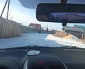 Улица Коммунальная. В самом центре поселения не делалась никогда на 5% был асфальт в 70-ых годах но уже рассыпался полностью. Грунт супесь. Плэтому для удобства строительной техники из-за узости улочек удобнее будет укладка плитами и дешевле тоже. Рядом находится Администрация города. Половина сделали полотно не хватает средств. Нет знаков уступи дорогу. ПРи выезде на региональную дорогу. Примыкает к региональной дороге. Асфальта нет.Есть ухабы и неровности. В дожди скапливается влага необходима ливневка есть место куда провести ливневку.