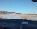 Новая дорога с помощью оптимизации бюджета при консультации и настоянии ОНФ Района сделана в 2021 году. Но сделан черновой вариант. Грунт старые отходы с региональной дороги проходящей мимо и в данный момент строящейся. Необходима на следующий год укладка бетонными плитами. Знаков нет. Под полотном глина и дерн. Сделана в 2021 году поэтому рытвины и ухабы и ямы.