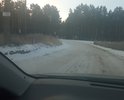 Муниципальная дорога на общественный полигон по накоплению мусора ТБО. ОТгрейдировано в 2021 году нет покрытия. Грунт суглинок и глина. ПОэтому дорогу быстро разбивает появляются ямы и непролазная грязь. Целессобразно покрыть бетонными плитами и не тратить бюджет много раз на ремонт постоянный. Знаков нет. Проходит через лесной массив. Используется общественным транспортом по вывозу мусора. Ямы есть и рельеф идет вдоль горок. Невыровнена. Необходима местами ливневка. Обочины сделаны но их быстро заполняет водой. Ширина около 2, 5 метров.