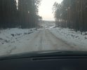 Муниципальная дорога на общественный полигон по накоплению мусора ТБО. ОТгрейдировано в 2021 году нет покрытия. Грунт суглинок и глина. ПОэтому дорогу быстро разбивает появляются ямы и непролазная грязь. Целессобразно покрыть бетонными плитами и не тратить бюджет много раз на ремонт постоянный. Знаков нет. Проходит через лесной массив. Используется общественным транспортом по вывозу мусора. Ямы есть и рельеф идет вдоль горок. Невыровнена. Необходима местами ливневка. Обочины сделаны но их быстро заполняет водой. Ширина около 2, 5 метров.