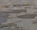 Убитая дорога, много ям, нет тротуаров по нормативам, во время дождя пешеходам затруднен проход.