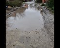 Очень глубокие ямы и выбоины в которых круглогодично стоит вода, если пройдет дождь, то грязь и лужи такие, что не то что человеку негде пройти, но и авто с трудом проезжает, нет никакого покрытия, ни разу никаких работ не проводилось