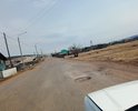 Республика Бурятия, село Кома, ул. Коммунистическая.
Дорога очень изношена, ямы, выкрашивание асфальта, промята колея. Нет тротуаров и площадок, подъездов у социальных объектов.