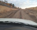 Дорога на муниципальное кладбище село Турунтаево. Покрытие грунтовое гравий. Требуется отсыпка. В настоящий момент рядом делается региональная дорога Турунтаево-Шергино и карьер находится в 12 км к востоку от Турунтаево и через поселок возят гравий в рамках Федеральных норм и правил грунт со старого полотна дороги требуется вывозить на полигон в 4 км от поселения, но данными СНИПАми разрешено использовать такой грунт на отсыпку улиц и дорог в рационализаторских целях по удешевлению сметы строительства дорог. Подрядчик экономит на том что нет необходимости вывозить далеко и тратить ГСМ на это и время. В 2022 глава поселения отсыпала 2 ямы на самом трудном участке. Дорога не имела асфальтового покрытия никогда. Пользуется все поселение. Необходима стоянка для авто в районе кладбища. Стоянка там расположена на горке. Грунт супесь и глина. После дождей образуются каверны ухудшающие проезжую часть.

Кроме того в 25 км расположен Черемшанский кварцит в настоящее время прокуратура провела проверку совместно с Бурприроднадзором и там было выявлено образование отходов от производства Кремния в случае отсутствия угрозы здоровью при экспертизе грунта в карьере его можно использовать для отсыпки дороги.Так как Бурприроднадзо потребует устранить насыпи незаконного образования полигона отходов карьера и его необходимо будет куда то складировать. Прошу передать в РИК ОНФ Бурятии. ПИсьмо составлено в МИнтранс РБ об этом. Но дополнительно прошу ОНФ проконтролировать.