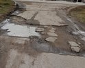 Ул.Пионерская, убитая дорога.Так же отсутствует освещение и тротуар.