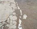 ПОМОГИТЕ С РЕМОНТОМ ДОРОГИ. Ремонта не было с 1955 года. По сути это строительные блоки, с торчащей арматурой, бордюрный камень укатали вровень с землёй. Халатность со стороны органов МСУ. Отправленные фото демонстрация размеров неприятности в летний период. Зимой просто КАРАУЛ. Если Вы не поможете остаётся только Путин. Спасибо.