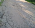 ПОМОГИТЕ С РЕМОНТОМ ДОРОГИ. Ремонта не было с 1955 года. По сути это строительные блоки, с торчащей арматурой, бордюрный камень укатали вровень с землёй. Халатность со стороны органов МСУ. Отправленные фото демонстрация размеров неприятности в летний период. Зимой просто КАРАУЛ. Если Вы не поможете остаётся только Путин. Спасибо.