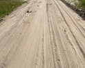 Дорогая по ул. Кирпичная не соответствует градостроительному плану, дорога проходит по прилегающей территории участков. Грунт на дороге мягкий. Весной по дороге нельзя проехать, образуются глубокие ямы, в грязи машины застревают. Летом, после того как проходит грейдер, за проезжающими автомобилями стоит столб 
 пыли. Летом и осенью по дороге можно проехать, но из-за мягкости грунта дорогу размывает после дождя.