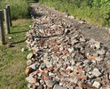 Засыпали дорогу развалинами от какого-то здания, с мусором, банками, и железной мантировкой, которая торчит из этих кирпичей! Здесь проехать на автомобиле не реально - не оставив колеса и брюха!