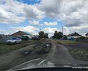 Центральная улица, деревня Север,
Чановский р-н 
Новосибирская обл.
Большие ямы (на фото - заполненные после дождя).
Асфальт, который тут когда то давно был, отсутствует