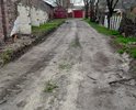 Выезд от гаражей происходит на ул. Николая Островского, г.Сальск. Большие ямы, при проезде машины цепляют днищем. Необходимо провести грейдирование.