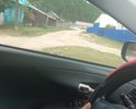 Сквозной проезд с улицы Кирова на Улицу Набережная грунтовая дорога. Состав грунта - песок. Узкая ширина. В зимнее время снег выпадает высотой около 1,5 метра и грейдер не может прочистить улицу. Зона посещения туристов и отдыха. По ней расположены причалы для лодок и гостевые домики. Улица сквозная ведет в конец поселка. Часто образуется дорожная рябь и ямы. Требуется асфальт в идеале. Уклон около 38 градусов. Часто размывается стоками с утеса требуется водосток с земляным фильтром. Требуется обновить земляные канавы для накопления дождевой воды. Вообще надо подумать над проектом. Выслал письмо такого характера:

Прошу обратить внимание в качестве перспективного участка под геодезические исследования дорожного полотна и песчаного основания под ним а так же гравия в селе Турка ( половинка). По испрашиваемому жителями ремонту дороги по улице Кирова и Набережной грунт соответствует ГОСТу ( Дорожные одежды песчаные). Поэтому разумно будет провести экспертизу участков и имея акт на руках пересчитать стоимость земляных работ на уменьшение. В данном случае около 70% проездов и дорог там будут соответствовать ГОСТу песчаные насыпи, что позволит сумму экономии передвинуть на проектирование каскадной ( мое предложение) водосливной системы проходящей по трубам под мостиками ( на них же и делать каскад) по земляным канавам. Земляные канавы остались со времен СССР и их необходимо заактировать и определить степень разрушения. При устройстве своим способом ( хозспособ возможность использовать 25% сметы на самозанятых на таких земляных работах согласно Закона РФ). Перед проездами, где пробегают талые воды считаю следует рассмотреть вопрос устройства бетонированных колодцев с проложенной трубой над потоком и проходящей дальше в такую канву. Такая канава ( слои дробленка, глина, песок, глина, дробленка более точный гост может подсказать проектировщик) станет дешевле для бюджета дорожного фонда и позволит направить средства на строительство двухсекционных песчаных фильтрационных резервуаров в конце ПОЛОВИНКИ и в местах определенных по водостокам вдоль дороги. При этом накопитель делается выше а потом отделяется фильтром земляным крупнозернистый песок с сердцевиной из дробленки и слой сверху мелкозернистого песка). То есть у нас будет природная фильтрация но в искусственном сооружении при этом техника может использоваться собственная, что позволит удешевить расходы. Такая схема может служить у нас типовой с различными вариациями по запросам жителей на сходах и в болотистых местностях. Канавы между желательно сообщать трубами под дорогой. При каскадном решении вода не переливается через край канав и не создается стремнинный поток при сильных осадках и система регулирует себя сама и с нее возможно осуществлять полив огородов. Поток создается в таком случае медленный и система не переполняется при диаметре труб на 70% больше площади сечения канвы. Канавы для удобства изготовления могут быть треугольными или полукруглыми или трапециевидными. Скат с горы проектируется бетонированный с устройством ребер тормозящих потоки с горы. При устройстве перил целесообразно рассмотреть использование габионов так как там есть свой камень и при устройстве столбиков это может проходить как капстроение и придаст колорит и необычный вид потом дороге на мостиках и ограждении резервуаров таких. Трубы кроме того могут по сроку службы улучшаться путем накладки феном промышленным полимерного слоя и простоты ремонта диаметр необходим около 1 м.. Принять во внимание например устройство из габионов ( блоков или плит) сливы ( водостоки с гор и распадков) уложив их по руслам. Это даст возможность проходить транспорту и пешеходам не затрудняя движения а вода при этом большей частью будет протекать в габионах и исполнимо для главы СП Туркинское. Перед горой предусмотреть устройство заграждения из габионов что дешевле будет чем завоз бетона и бетонирование. Вместо мостиков предлагаю уложить по 2 трубы соединенных между собою цементным раствором это будет разделать потоки с распадков и уменьшать скорость потоков. Габионами можно уложить постепенно поэтапно русла таких распадков размывающих улицы по с. Турка в том числе заглубив русло миниэкскаватором. Вместо мостиков для придания единого архитектурного ансамбля уложить трубы и использовать старую дорожную одежду для отсыпки подъездов к дворам что снизит количество конфликтов и проблем. В трубах можно предусмотреть затворы для накопления воды в засуху для полива огородов и перила из габионов. Трубы так же могут прокладываться в таком случае через ручьи в конце улицы Кирова имеется ручей. Что полностью будет соответствовать требованиям Водного кодекса и экологически чистому использованию разных вид вод в последующем и не создаст неприятностей с Роспотребнадзором. Предусмотреть укладку георешетки и холодной асфальтной мастики на проезжую часть это упростит укладку асфальта в холодное время. В целом такой подход позволит увеличить протяженность сделанной улицы. Обращаю внимание что мастика продавливается со временем и там необходимо укладка 1 слоя дробленки под мастикой.
  Данный подход будет применим и для Гремячинска и для Горячинска учитывая что там очень сложно с устройством АБЗ и варки горячего асфальта.