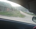 Сквозной проезд на улицу Кирова в с. Турка. Ямины, рытвины, грунт песок и супесь. Зимой нет возможности проехать из-за снега 1, 5 метра. Горные сточные воды стекают размывают постоянно. Необходимо выровнять и отсыпать дробленкой. Целесообразна холодная асфальтовая мастика в связи с экологическими требованиями санитарной зоны вокруг Байкала. Проезд ведет к гостевым домикам и жилым домам. Нет водостока. Ведет на набережную. Необходима грейдировка. Асфальта не было никогда. Нет пешеходной зоны. Турка туристическая основная зона и дорогами пользуется много туристов на авто. Проезд расположен в старом горном распадке часто весной талые воды размывают проезд.