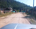 Сквозной проезд на улицу Кирова с улицы Лесная в с. Турка. Ямины, рытвины, грунт песок и супесь. Зимой нет возможности проехать из-за снега 1, 5 метра. Горные сточные воды стекают размывают постоянно. Необходимо выровнять и отсыпать дробленкой. Целесообразна холодная асфальтовая мастика в связи с экологическими требованиями санитарной зоны вокруг Байкала. Проезд ведет к гостевым домикам и жилым домам. Нет водостока. Ведет на набережную. Необходима грейдировка. Асфальта не было никогда. Нет пешеходной зоны. Турка туристическая основная зона и дорогами пользуется много туристов на авто. Проезд расположен в старом горном распадке часто весной талые воды размывают проезд.