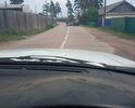 Улица С. Лазо с. турунтаево образовалось опускание подушки после капремонта теплосетей в 2016 году примерно. Опускание произошло на 5 см в виде треугольной выемки по всей ширине проезжей части. Ишрина опускания около 10 см судя по всему по ширине трубы. Необходимо произвести выемку краев и забетонировать. В темное время создает значительные проблемы. Ненормативный участок. Локальный дефект. грунт ПГС и песок. Пучинистых мест нет. основание песчаное.