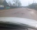 Образовывается яма и вспучивание опасное для проезда авто. высота уже примерно 5 см выше проезжей части. Продавливание связано с пучинистым грунтом и тонким слоем асфальта. Необходим будет ремонт. Или положить бетонную плиту по размеру ямы.