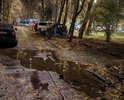 После ремонта теплотрассы и проведения ремонта произошла просадка грунта, что привело к образованию ям глубиной более 5 см и шириной несколько метров.Всего таких ям на указанном участке более 5.