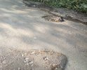 Разбитые ямами дороги по ул.Пшеницина до 50 лет Октября в поселке Трудовое
