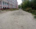 Построили новые дома, а дорогу так и не сделали. Рядом Налоговая служба.