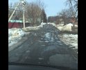 Остатки асфальта советских времён. Каждый месяц пускают грейдер сравнять ухабы. Дорога сквозная ещё на три улицы ездят все. С детьми с коляской идти просто невозможно.
