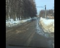 Остатки асфальта советских времён. Каждый месяц пускают грейдер сравнять ухабы. Дорога сквозная ещё на три улицы ездят все. С детьми с коляской идти просто невозможно.