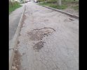 Полностью убитая дорога, огромные ямы глубиной 15 см и шириной по полметра. Необходимо устранить и положить на асфальт