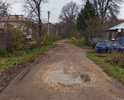 Страшно "убитая" дорога. Нет возможности пройти и проехать. Огромные ямы, грязь, и лужи.