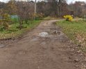 Страшно "убитая" дорога. Нет возможности пройти и проехать. Огромные ямы, грязь, и лужи.