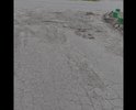 Большая яма, асфальта нет, оставшееся покрытие всё в трещинах и разломах. В дождливую погоду не объехать не обойти,т.к нет тротуара.
