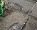 Ямы около подъезда.Просьба произвести работы: отремонтировать.