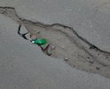 Вся улица Полупанова в огромных ямах